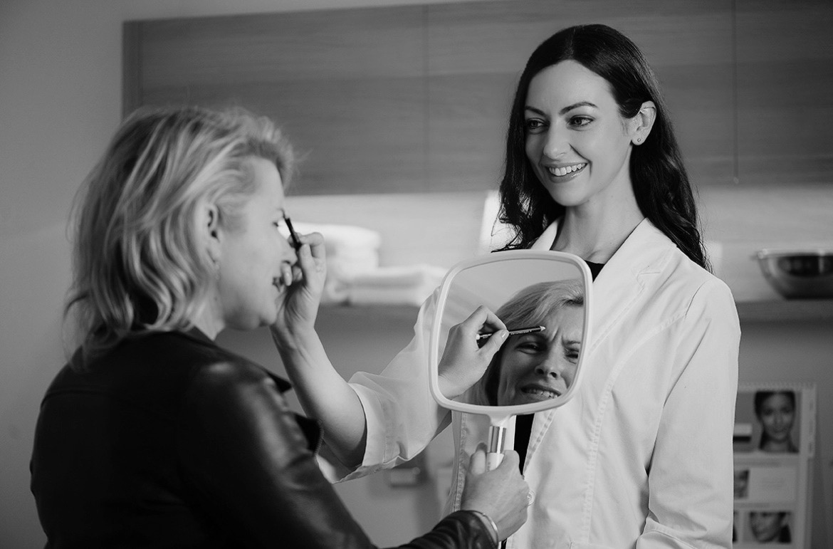 Michelle Dodd, Registered Nurse conducting a facial volume assessment