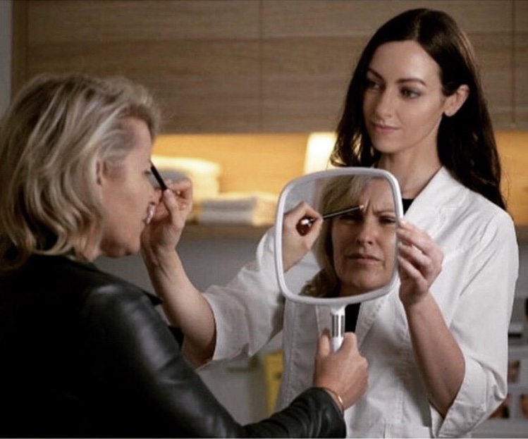 Michelle Dodd, Registered Nurse assessing facial movement during consultation